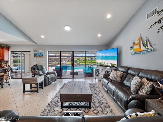 1431 SW 53rd Ln, Cape Coral, FL 33914 - living area featuring lofted ceiling, light tile patterned flooring, and recessed lighting