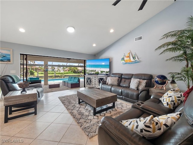 1431 SW 53rd Ln, Cape Coral, FL 33914 - living room with light tile patterned floors, recessed lighting, a ceiling fan, and high vaulted ceiling