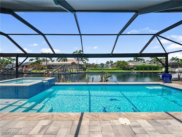1431 SW 53rd Ln, Cape Coral, FL 33914 - view of pool featuring glass enclosure, a water view, a pool with connected hot tub, and a patio