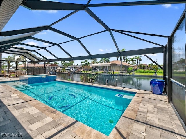 1431 SW 53rd Ln, Cape Coral, FL 33914 - view of pool featuring a patio area, a water view, a pool with connected hot tub, and a lanai