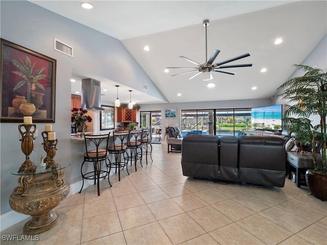 1431 SW 53rd Ln, Cape Coral, FL 33914 - living room featuring light tile patterned floors, ceiling fan, high vaulted ceiling, and recessed lighting