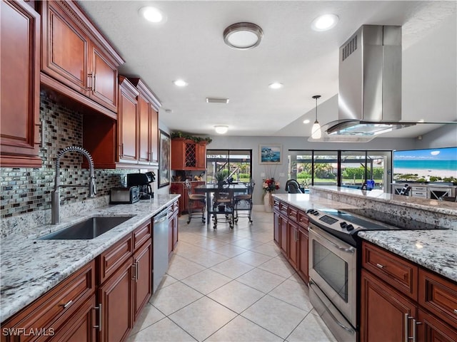 1431 SW 53rd Ln, Cape Coral, FL 33914 - kitchen with stainless steel appliances, island exhaust hood, light tile patterned floors, tasteful backsplash, and recessed lighting