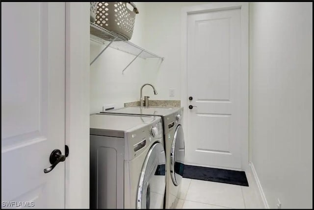 2229 SW 17th Pl, Cape Coral, FL 33991 - laundry area with washing machine and dryer and tile patterned flooring