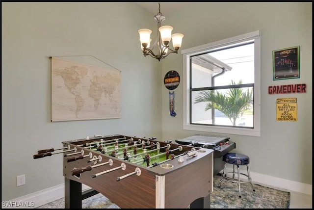 2229 SW 17th Pl, Cape Coral, FL 33991 - rec room with baseboards and a chandelier