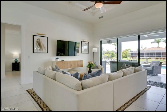 2229 SW 17th Pl, Cape Coral, FL 33991 - living room with ceiling fan, light tile patterned floors, and a high ceiling