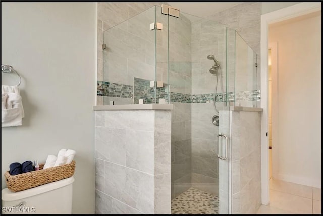 2229 SW 17th Pl, Cape Coral, FL 33991 - bathroom featuring a shower stall and tile patterned floors