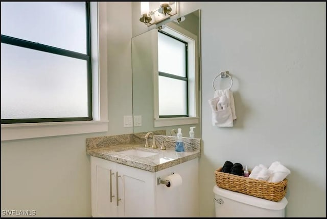2229 SW 17th Pl, Cape Coral, FL 33991 - half bathroom featuring vanity and toilet