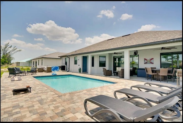 2229 SW 17th Pl, Cape Coral, FL 33991 - swimming pool with ceiling fan, an outdoor hangout area, a patio area, and outdoor dining area