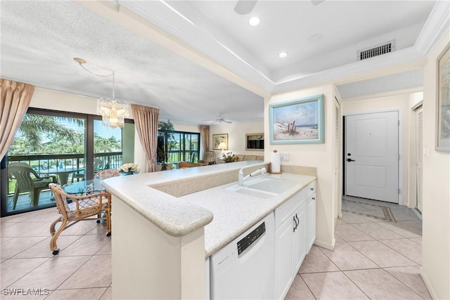 519 Seaview Ct Unit N4, Marco Island, FL 34145 - kitchen featuring dishwasher, light countertops, white cabinets, a peninsula, and light tile patterned floors