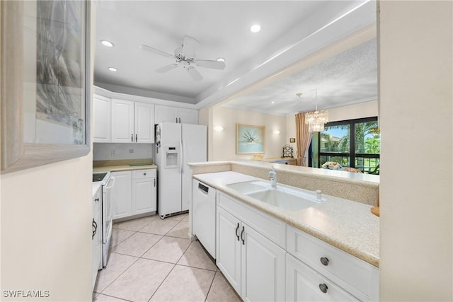 519 Seaview Ct Unit N4, Marco Island, FL 34145 - kitchen featuring white appliances, white cabinets, light countertops, light tile patterned floors, and ceiling fan