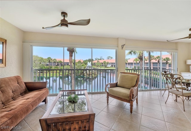6720 Beach Resort Dr Unit 10, Naples, FL 34114 - living room with a ceiling fan, healthy amount of natural light, and light tile patterned floors