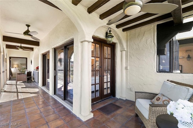 5850 Pelican Bay Blvd Unit C, Naples, FL 34108 - view of patio / terrace with french doors and ceiling fan