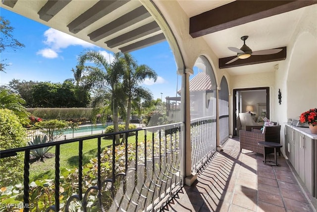 5850 Pelican Bay Blvd Unit C, Naples, FL 34108 - balcony with view of pool area and a ceiling fan