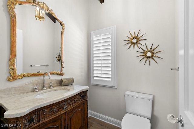 5850 Pelican Bay Blvd Unit C, Naples, FL 34108 - bathroom featuring vanity and wood finished floors