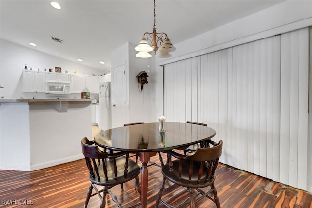 1439 SW Embers Ter, Cape Coral, FL 33991 - dining room featuring dark wood finished floors, lofted ceiling, recessed lighting, and a chandelier