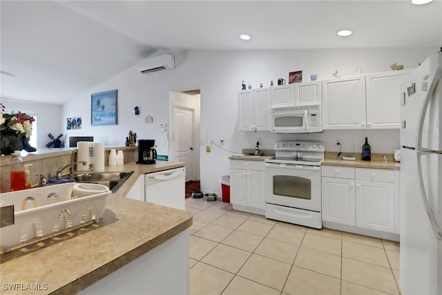 1439 SW Embers Ter, Cape Coral, FL 33991 - kitchen with white appliances, a wall mounted AC, lofted ceiling, light tile patterned floors, and white cabinetry