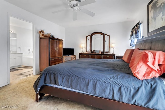 1439 SW Embers Ter, Cape Coral, FL 33991 - carpeted bedroom with ensuite bath and ceiling fan