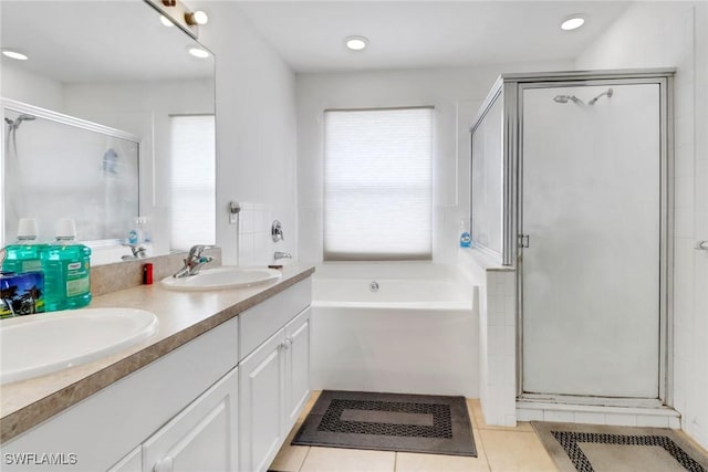 1439 SW Embers Ter, Cape Coral, FL 33991 - full bathroom with a garden tub, healthy amount of natural light, double vanity, a stall shower, and recessed lighting