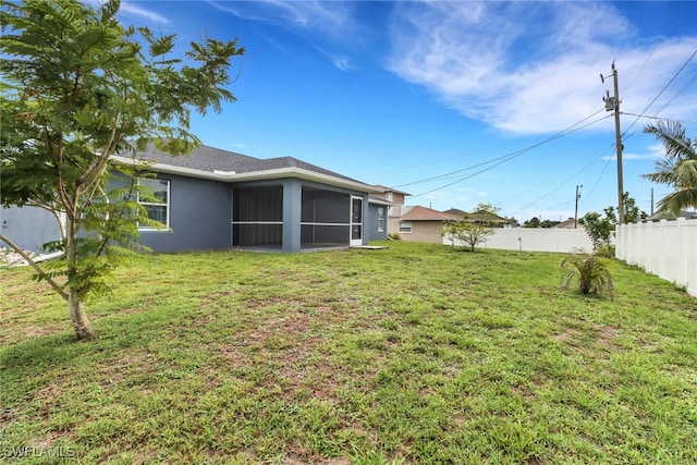 1439 SW Embers Ter, Cape Coral, FL 33991 - view of yard featuring a sunroom