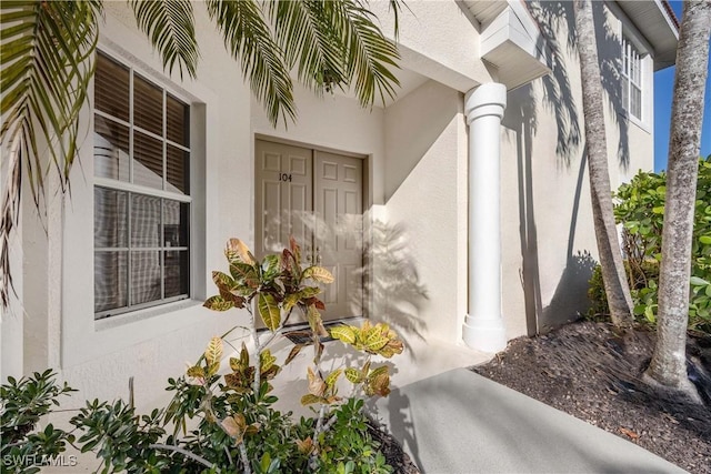4660 Winged Foot Ct Unit 104, Naples, FL 34112 - property entrance featuring stucco siding