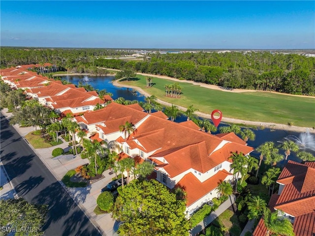 4660 Winged Foot Ct Unit 104, Naples, FL 34112 - drone / aerial view of a large body of water and a golf course