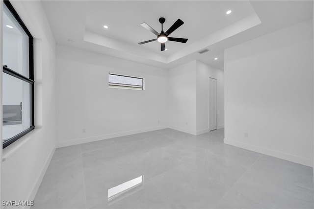 1405 SW 28th Ter, Cape Coral, FL 33914 - empty room featuring a tray ceiling, recessed lighting, and ceiling fan