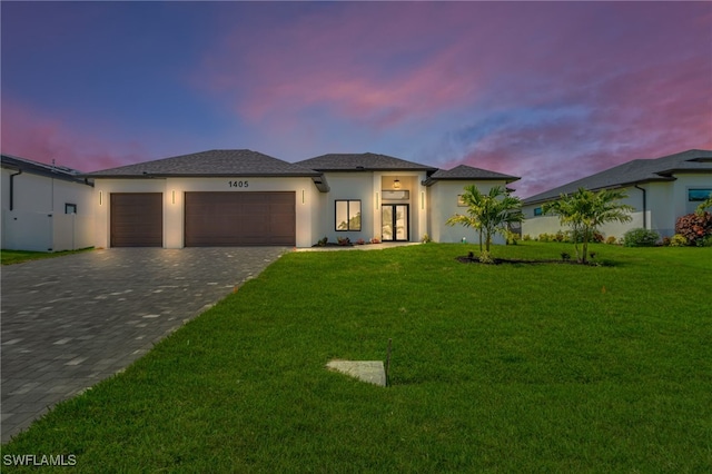 1405 SW 28th Ter, Cape Coral, FL 33914 - view of front of house featuring a garage, decorative driveway, stucco siding, and a front lawn