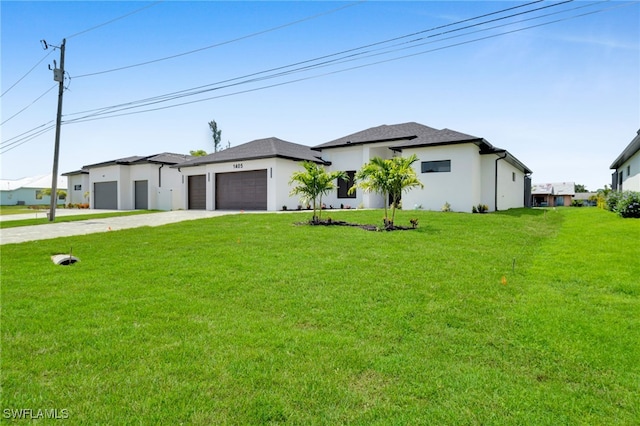 1405 SW 28th Ter, Cape Coral, FL 33914 - prairie-style home featuring driveway, an attached garage, a front lawn, and stucco siding