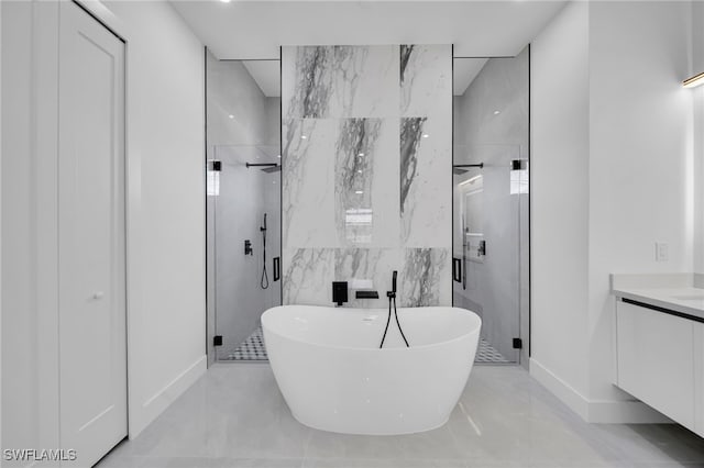 1405 SW 28th Ter, Cape Coral, FL 33914 - full bathroom with a shower stall, a soaking tub, vanity, and tile walls