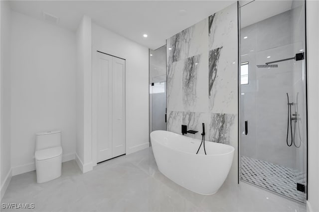 1405 SW 28th Ter, Cape Coral, FL 33914 - full bath with a stall shower, a freestanding tub, recessed lighting, and tile walls