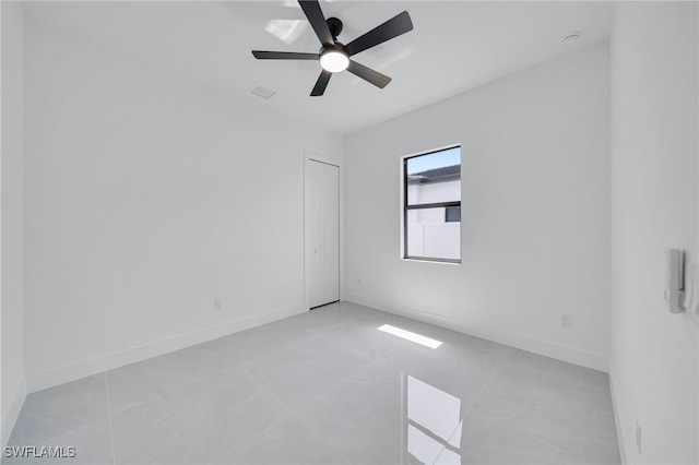 1405 SW 28th Ter, Cape Coral, FL 33914 - empty room with a ceiling fan and light tile patterned floors
