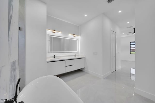 1405 SW 28th Ter, Cape Coral, FL 33914 - bathroom featuring a freestanding tub, double vanity, recessed lighting, and a ceiling fan
