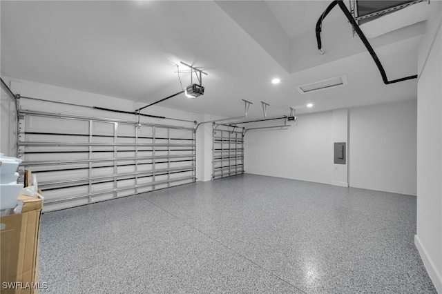 1405 SW 28th Ter, Cape Coral, FL 33914 - garage featuring a garage door opener, electric panel, and recessed lighting