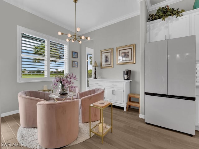 15904 Talon Ter, Punta Gorda, FL 33982 - sitting room with crown molding, light wood-type flooring, and a chandelier