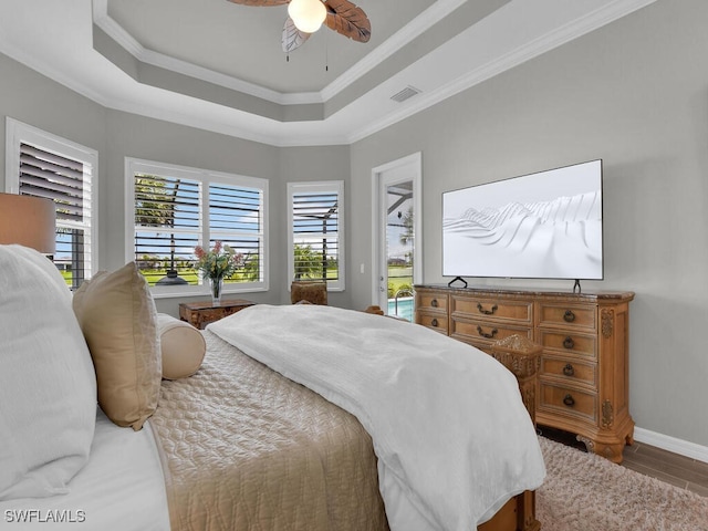 15904 Talon Ter, Punta Gorda, FL 33982 - bedroom with access to outside, crown molding, a tray ceiling, and ceiling fan