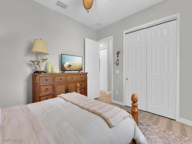 15904 Talon Ter, Punta Gorda, FL 33982 - bedroom with light wood finished floors, a closet, and a ceiling fan