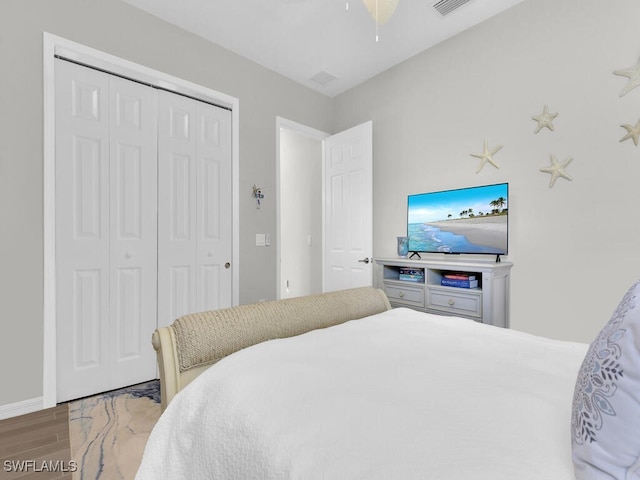 15904 Talon Ter, Punta Gorda, FL 33982 - bedroom featuring wood finished floors, a closet, and ceiling fan