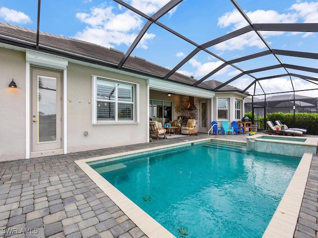 15904 Talon Ter, Punta Gorda, FL 33982 - view of swimming pool featuring a patio, a pool with connected hot tub, an outdoor living space, glass enclosure, and a ceiling fan