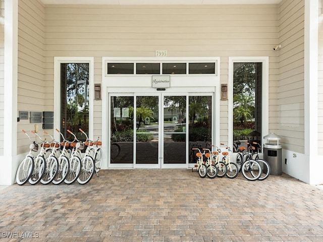 7970 Mahogany Run Ln Unit 216, Naples, FL 34113 - view of exterior entry with a surveillance system