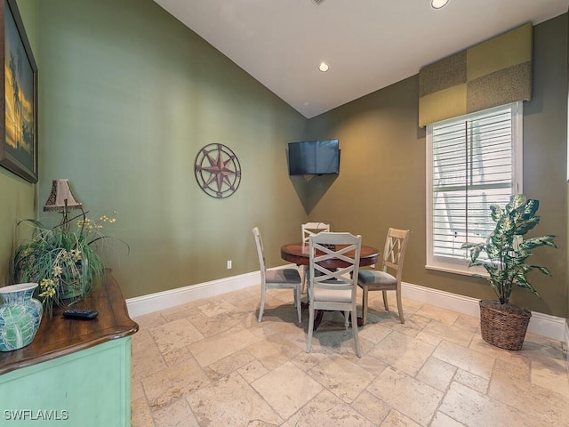 7970 Mahogany Run Ln Unit 216, Naples, FL 34113 - dining area featuring stone tile floors, recessed lighting, and high vaulted ceiling