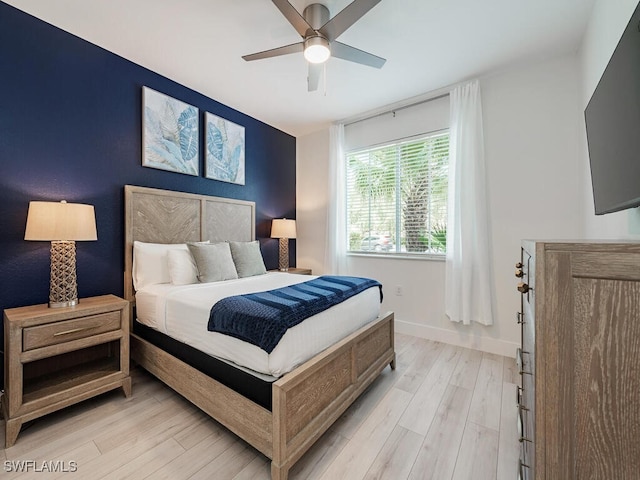 7970 Mahogany Run Ln Unit 216, Naples, FL 34113 - bedroom with light wood-style floors and a ceiling fan
