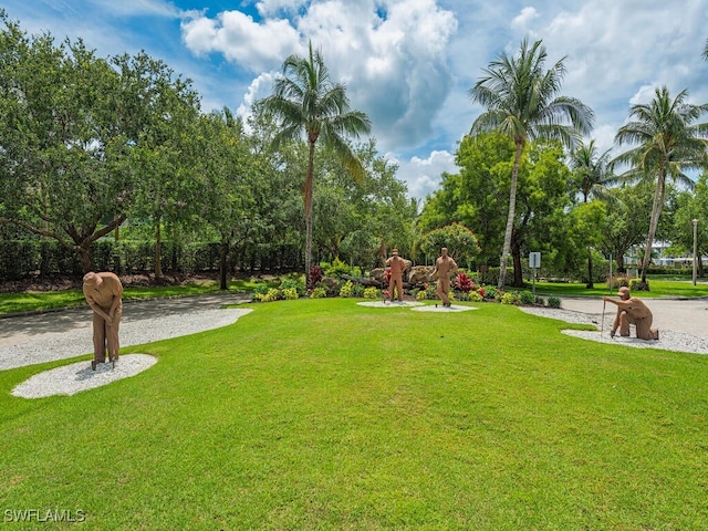 7970 Mahogany Run Ln Unit 216, Naples, FL 34113 - view of grassy yard featuring view of wooded area