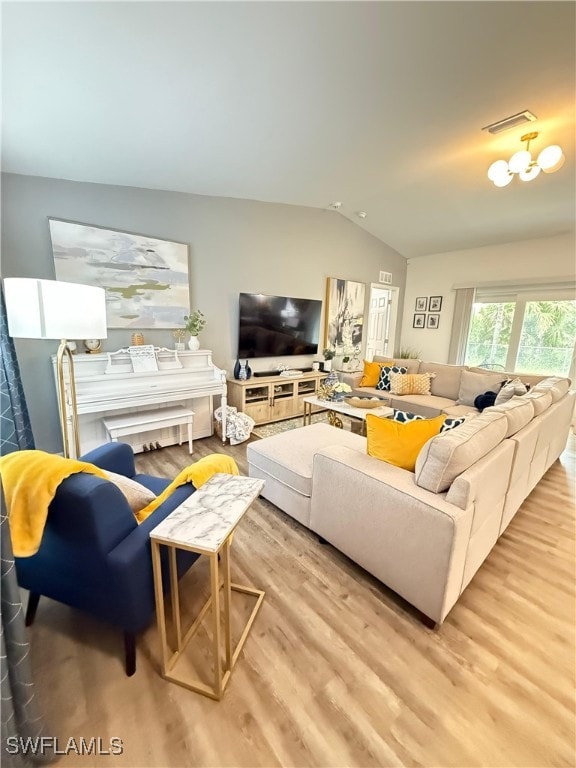 3006 Base Ct, Labelle, FL 33935 - living room with vaulted ceiling and wood finished floors