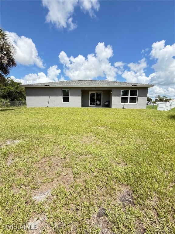 3006 Base Ct, Labelle, FL 33935 - rear view of house with stucco siding