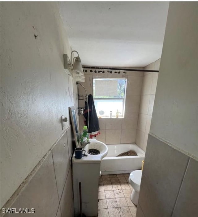 2027 Mark Ave, Punta Gorda, FL 33950 - bathroom featuring toilet and bathing tub / shower combination