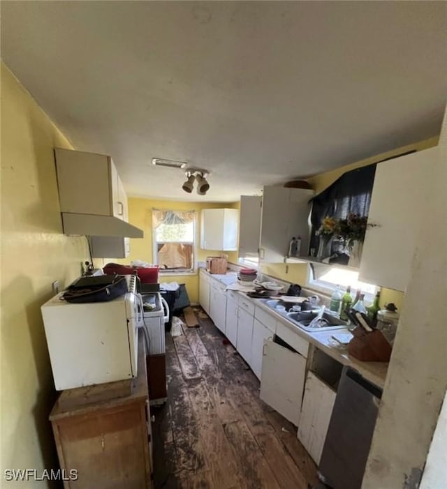 2027 Mark Ave, Punta Gorda, FL 33950 - kitchen featuring dark wood-style floors, white cabinets, and light countertops