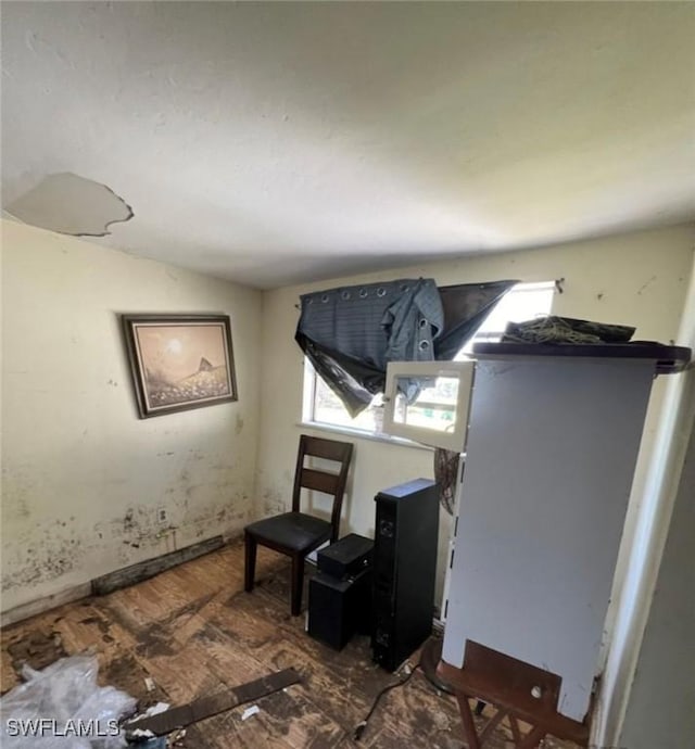 2027 Mark Ave, Punta Gorda, FL 33950 - bedroom with multiple windows, wood finished floors, and lofted ceiling