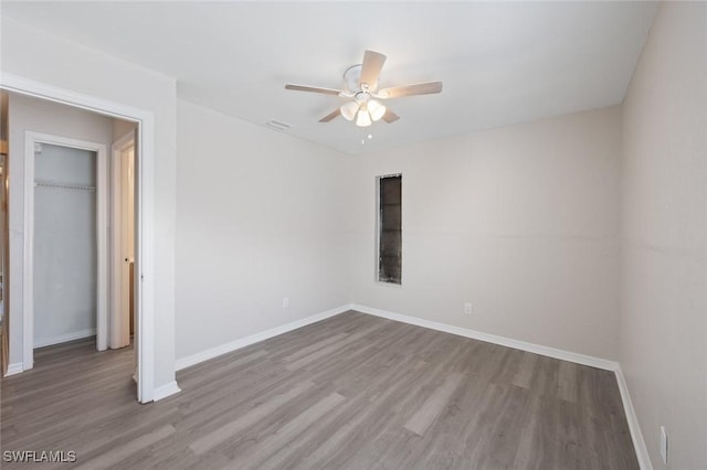 27924 Quinn St, Bonita Springs, FL 34135 - spare room featuring a ceiling fan and wood finished floors