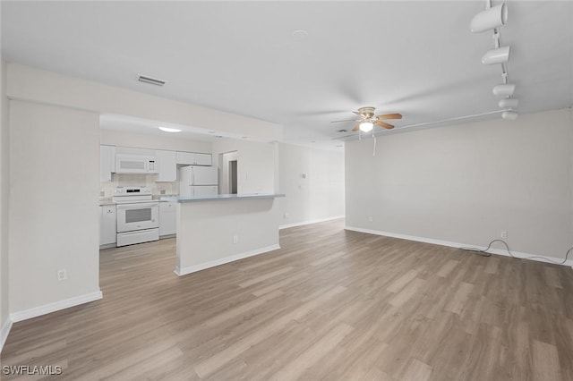 27924 Quinn St, Bonita Springs, FL 34135 - unfurnished living room featuring a ceiling fan and light wood-style flooring