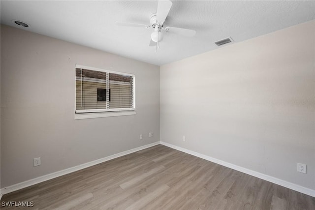 27924 Quinn St, Bonita Springs, FL 34135 - unfurnished room featuring wood finished floors and a ceiling fan